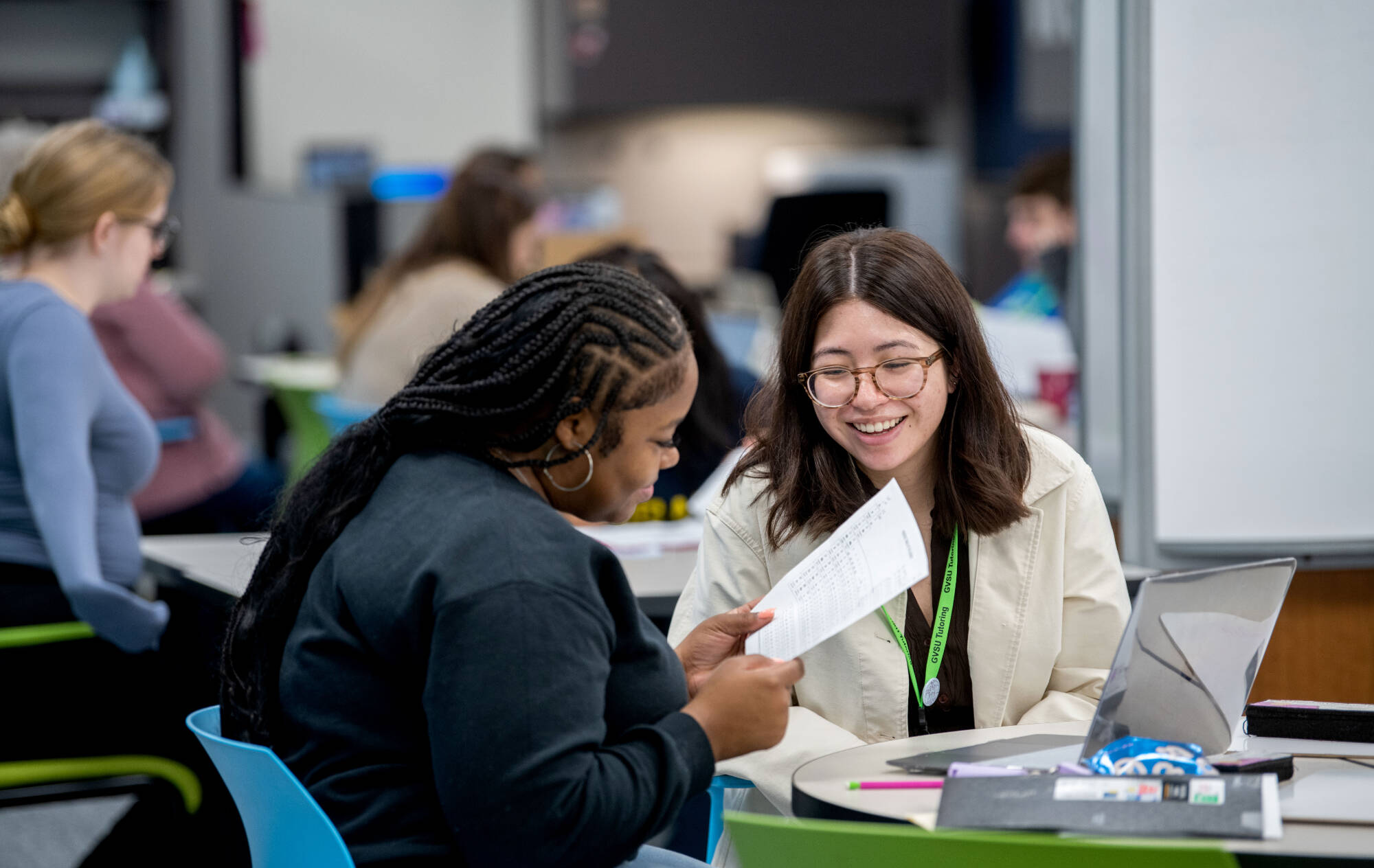 Angela Tran, right, tutors Jainell Denham Carter, left, in chemistry in the new Tutoring and Reading Center in Henry Hall September 27.(Photo releases on file)